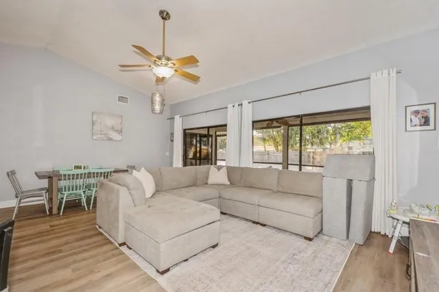 a living room with furniture and a large window