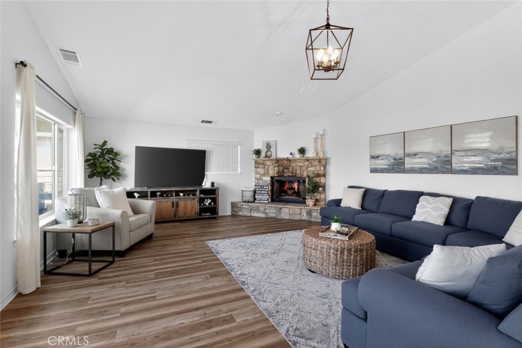 26502 Bluewater Road Helendale, CA 92342 - Photo 11 of 30 a living room with furniture a flat screen tv and a large window