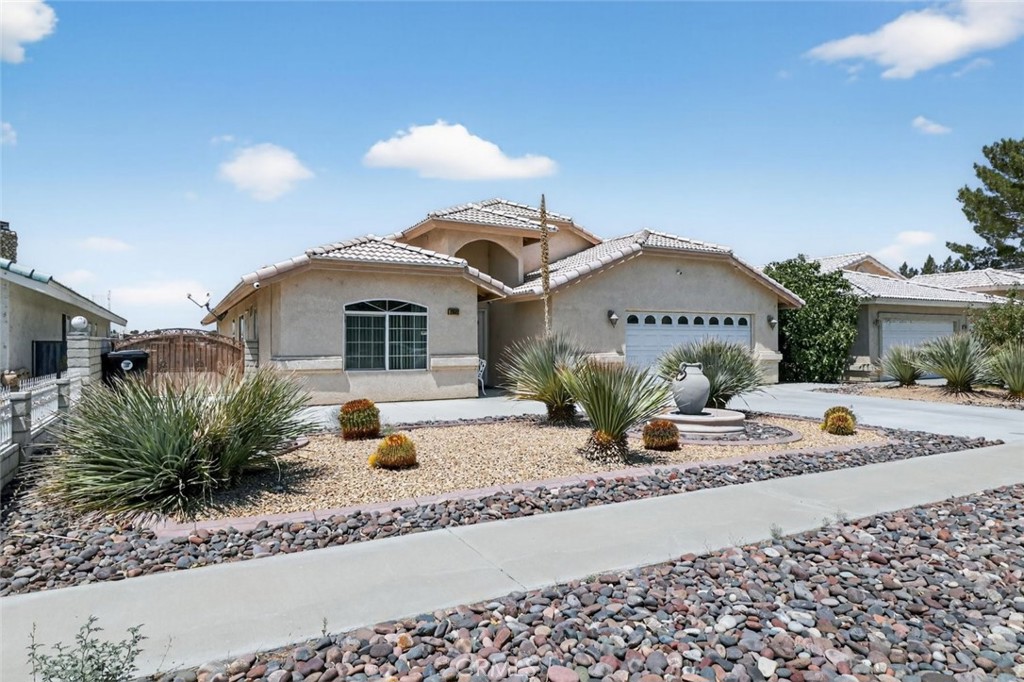 26502 Bluewater Road Helendale, CA 92342 - Photo 2 of 30 a front view of a house with entertaining space
