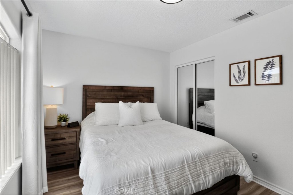 26502 Bluewater Road Helendale, CA 92342 - Photo 23 of 30 a bedroom with a bed and a night stand