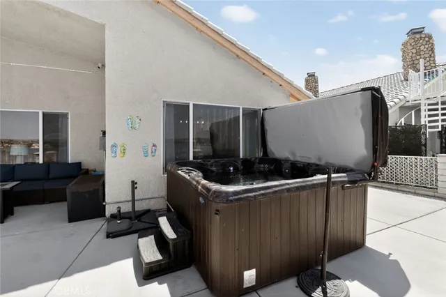 a kitchen with stainless steel appliances granite countertop a sink and a refrigerator
