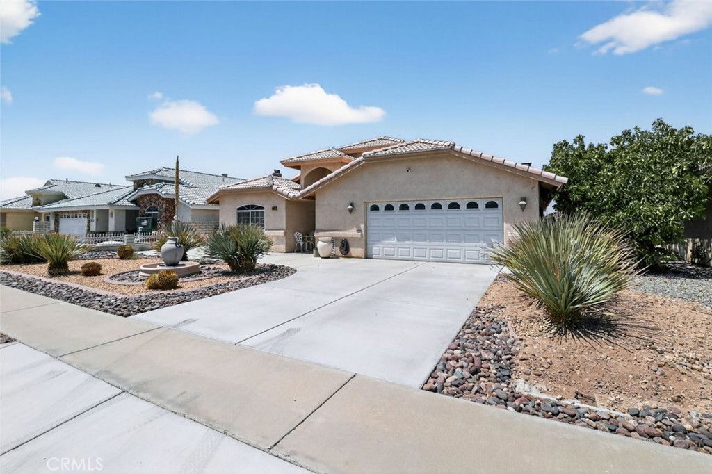 26502 Bluewater Road Helendale, CA 92342 - Photo 3 of 30 a view of multiple houses with a yard