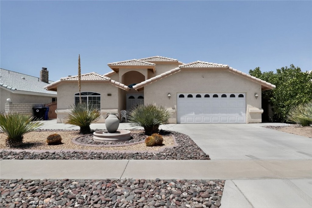 26502 Bluewater Road Helendale, CA 92342 - Photo 4 of 30 a front view of a house with entertaining space
