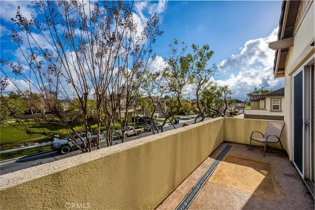 a view of balcony with wooden floor