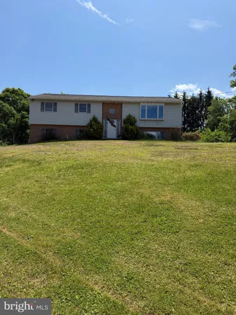 a view of house with outdoor space