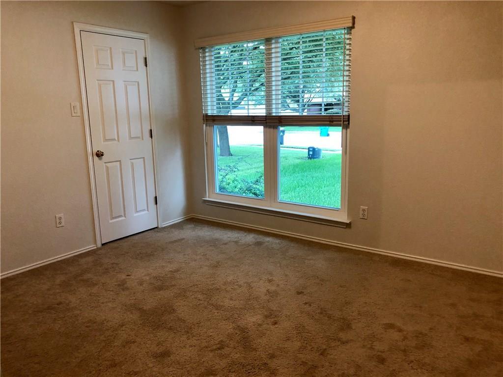 1515 Lochaline Loop Pflugerville, TX 78660 - Photo 8 of 12 Spare room with dark colored carpet and baseboards