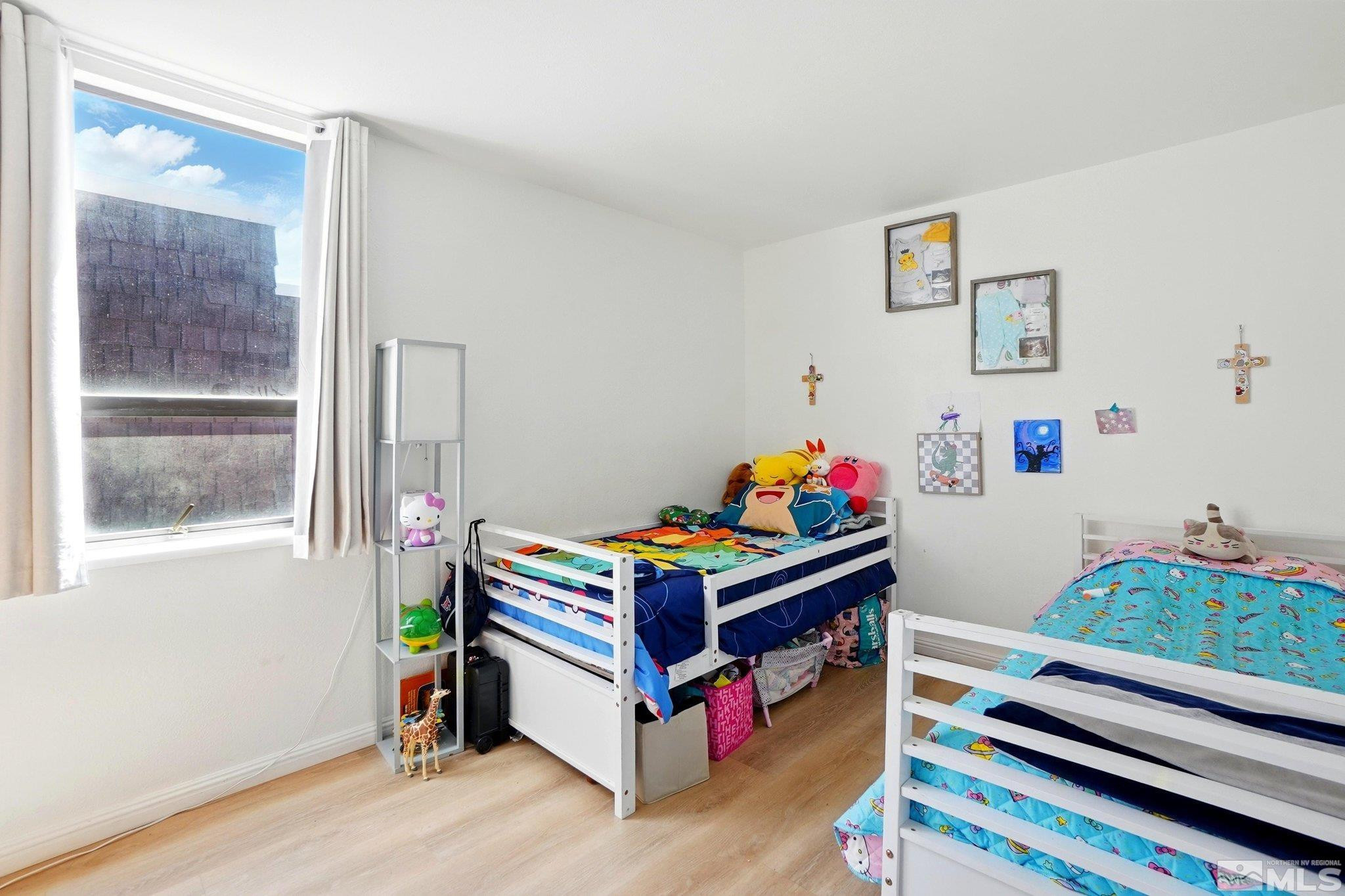4185 Baker Lane Reno, NV 89509 - Photo 11 of 21 a bed room with furniture and a window