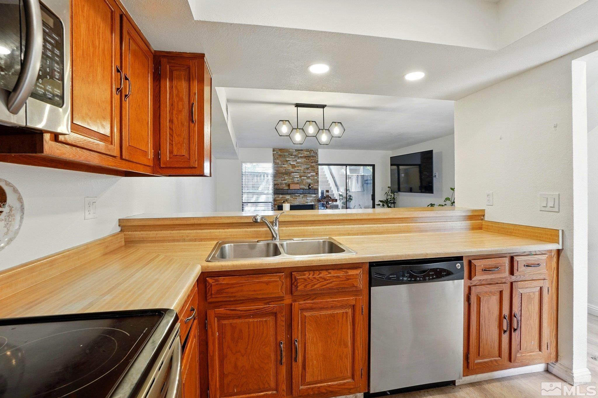 4185 Baker Lane Reno, NV 89509 - Photo 3 of 21 a kitchen with a sink and cabinets