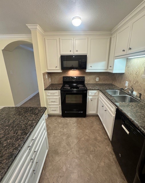 14020 Schroeder Road, Unit 151 Houston, TX 77070 - Photo 8 of 26 a kitchen with stainless steel appliances granite countertop a stove a sink and a microwave