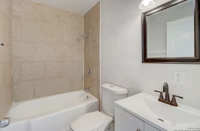 a bathroom with a sink toilet and bathtub