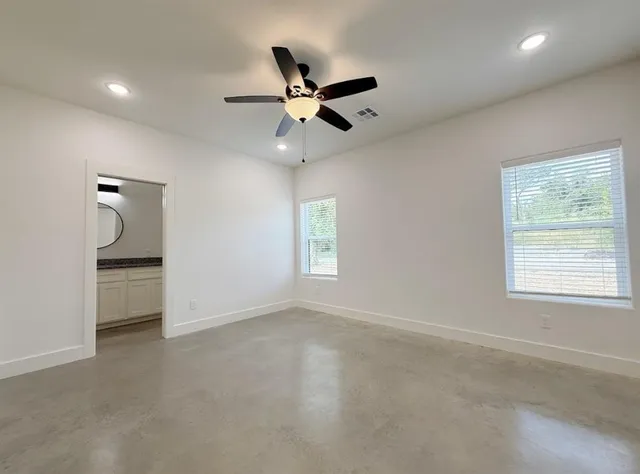 wooden floor in an empty room and a window