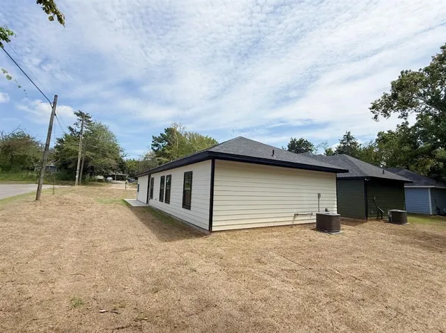 a backyard of a house with lots of green space
