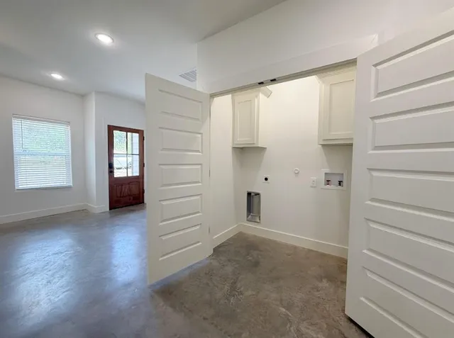 a kitchen with stainless steel appliances granite countertop a stove and a refrigerator