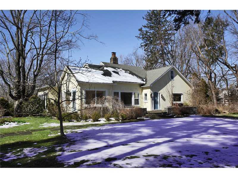 117 Marshall Ridge Road New Canaan, CT 06840 - Photo 1 of 20 a front view of a house with a yard