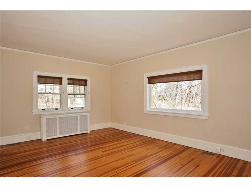 117 Marshall Ridge Road New Canaan, CT 06840 - Photo 15 of 20 a view of an empty room with wooden floor and a window