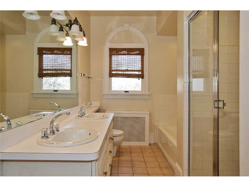 117 Marshall Ridge Road New Canaan, CT 06840 - Photo 17 of 20 a bathroom with a sink and a mirror