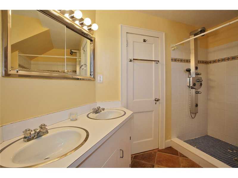 117 Marshall Ridge Road New Canaan, CT 06840 - Photo 19 of 20 a bathroom with a sink and a mirror