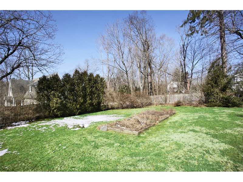 117 Marshall Ridge Road New Canaan, CT 06840 - Photo 3 of 20 a backyard of a house with lots of green space