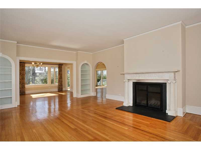 117 Marshall Ridge Road New Canaan, CT 06840 - Photo 5 of 20 a view of empty room with wooden floor and fireplace
