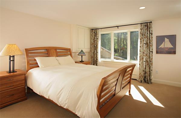 124 South Great Road Lincoln, MA 01773 - Photo 15 of 17 a spacious bedroom with a bed and a window