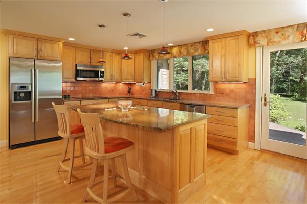124 South Great Road Lincoln, MA 01773 - Photo 8 of 17 a kitchen with stainless steel appliances granite countertop a stove a refrigerator a sink and white cabinets with wooden floor