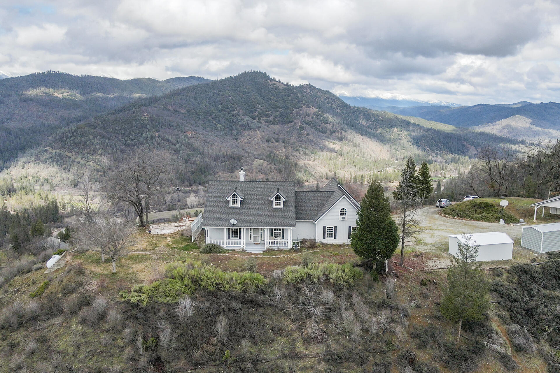 1551 Oak Ranch Road Lewiston, CA 96052 - Photo 1 of 35 a view of a house with a mountain in the background