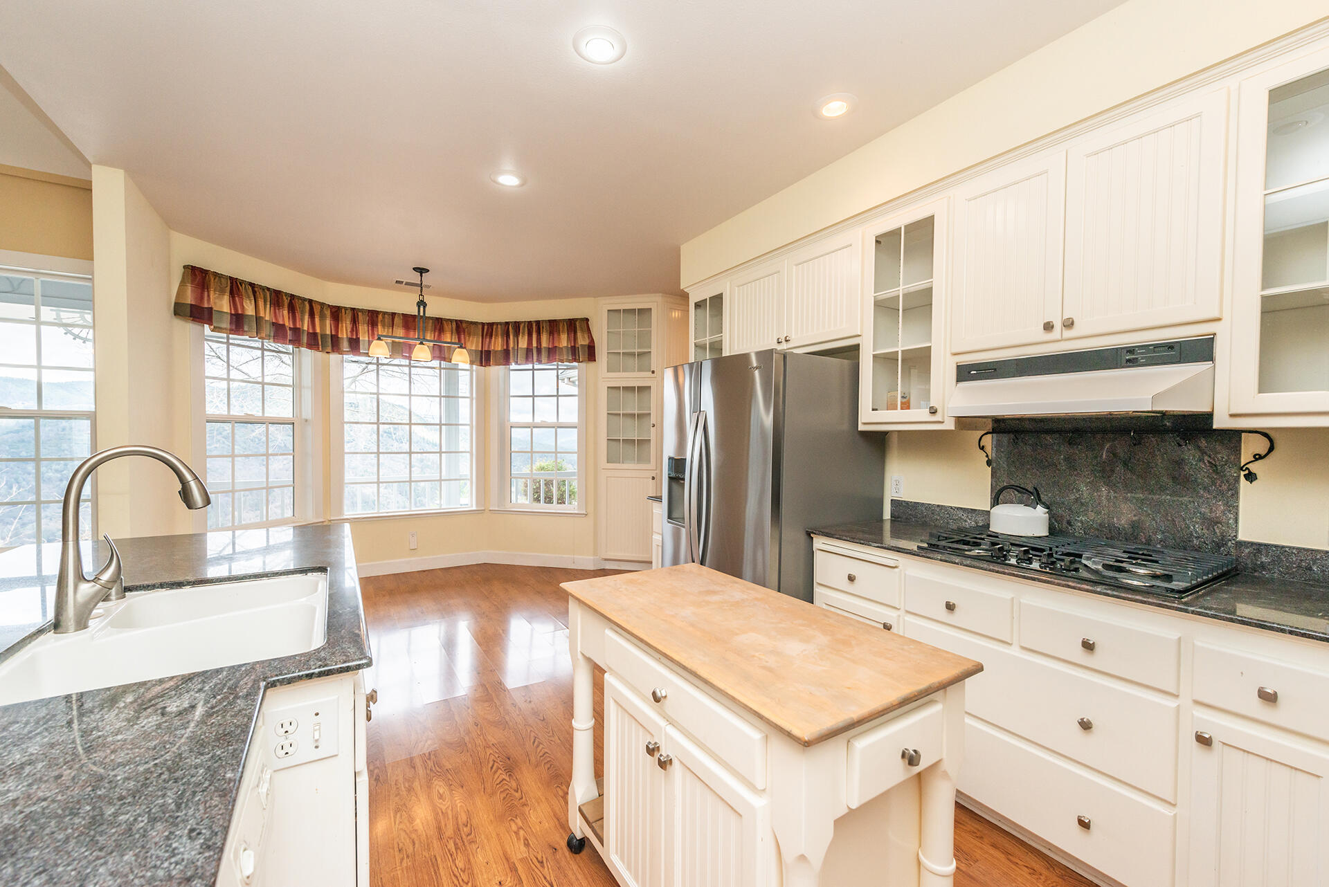 1551 Oak Ranch Road Lewiston, CA 96052 - Photo 21 of 35 a kitchen with granite countertop a sink stainless steel appliances and cabinets