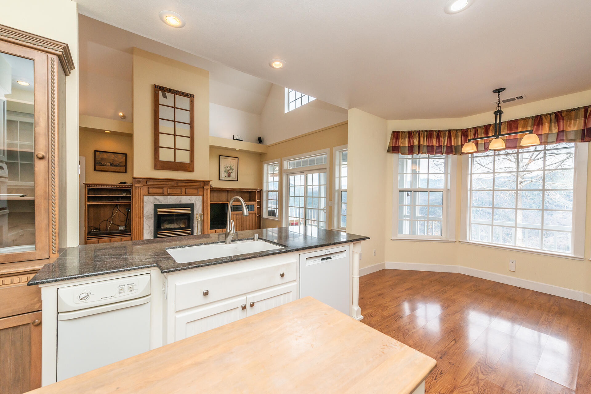 1551 Oak Ranch Road Lewiston, CA 96052 - Photo 24 of 35 a kitchen with granite countertop a stove and cabinets