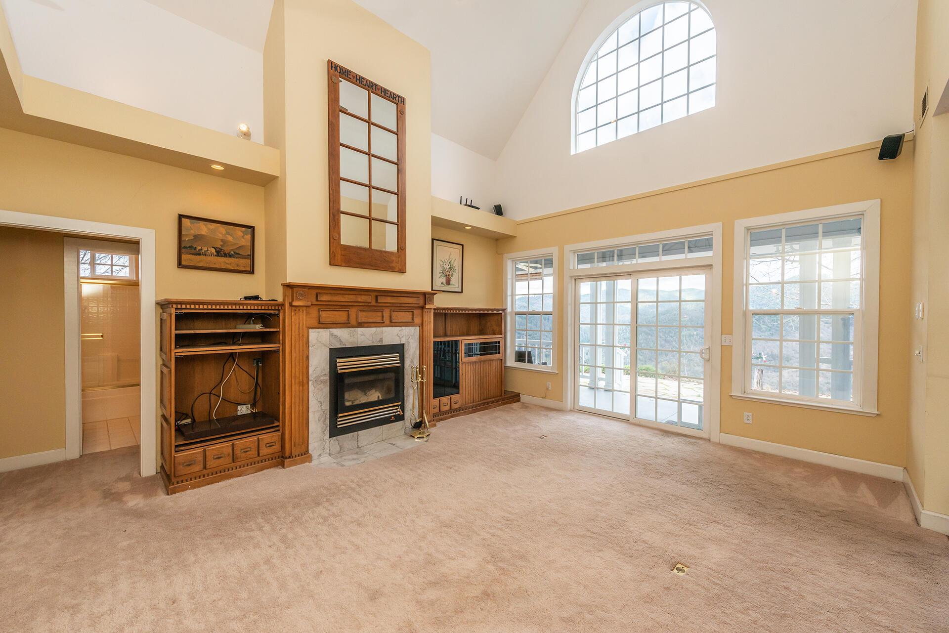 1551 Oak Ranch Road Lewiston, CA 96052 - Photo 3 of 35 a view of a livingroom with a fireplace and a window