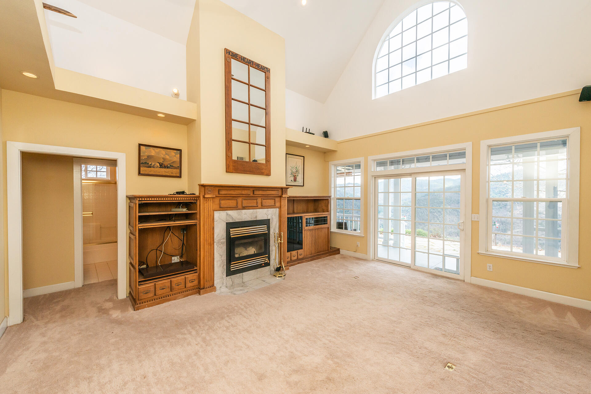 1551 Oak Ranch Road Lewiston, CA 96052 - Photo 9 of 35 a view of a livingroom with a fireplace and windows