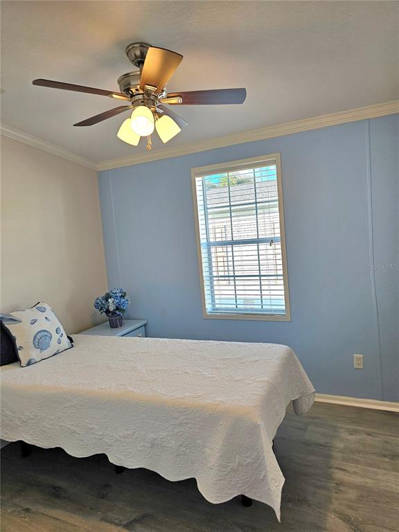 27 Freeman Avenue Punta Gorda, FL 33950 - Photo 12 of 32 a bedroom with a bed and a window