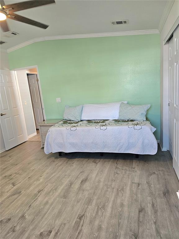 27 Freeman Avenue Punta Gorda, FL 33950 - Photo 17 of 32 a room with a bed and a mirror