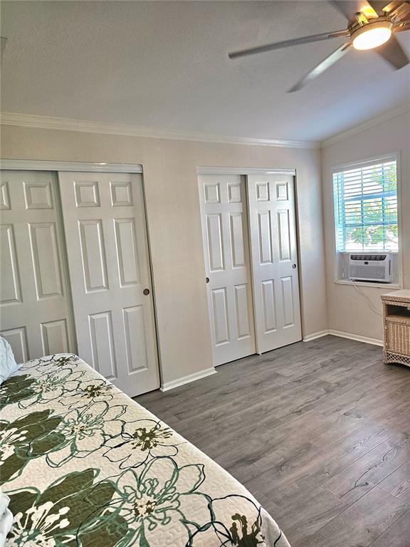 27 Freeman Avenue Punta Gorda, FL 33950 - Photo 20 of 32 a bedroom with a bed and wooden floor