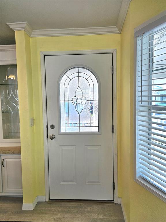 27 Freeman Avenue Punta Gorda, FL 33950 - Photo 2 of 32 a view of front door with wooden floor