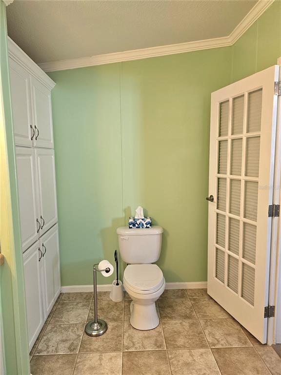27 Freeman Avenue Punta Gorda, FL 33950 - Photo 23 of 32 a bathroom with a toilet and a shower