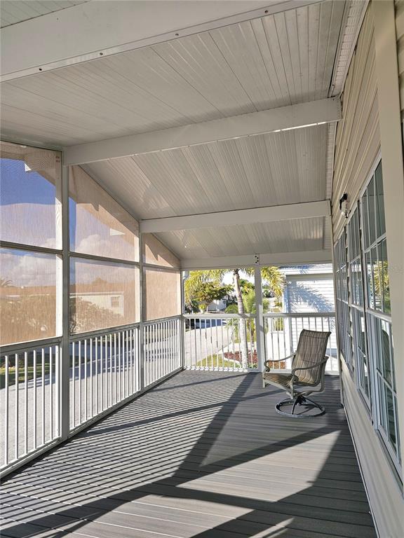 27 Freeman Avenue Punta Gorda, FL 33950 - Photo 3 of 32 a view of a patio with wooden floor and iron stairs