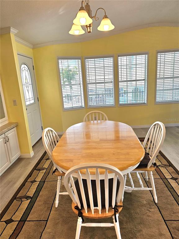 27 Freeman Avenue Punta Gorda, FL 33950 - Photo 5 of 32 a view of a dining room with furniture window and outside view