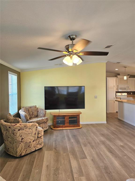 27 Freeman Avenue Punta Gorda, FL 33950 - Photo 8 of 32 a living room with furniture and a flat screen tv