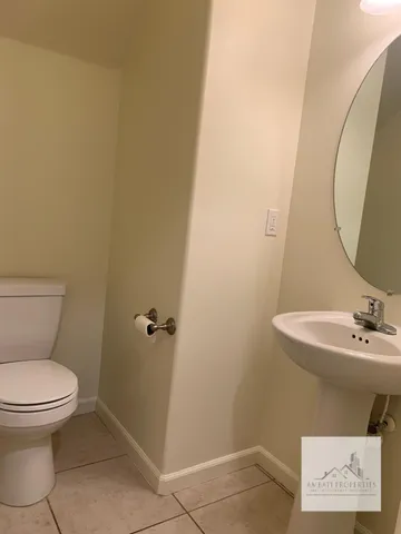 a bathroom with a toilet and a sink