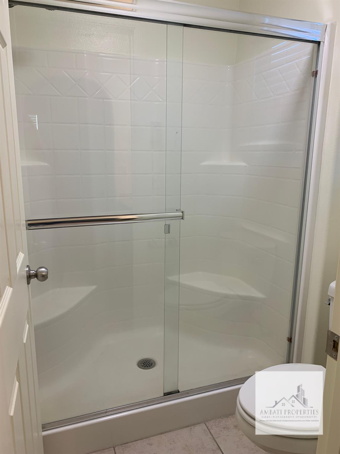 3663 Etchings Way Clovis, CA 93619 - Photo 16 of 26 a bathroom with a shower