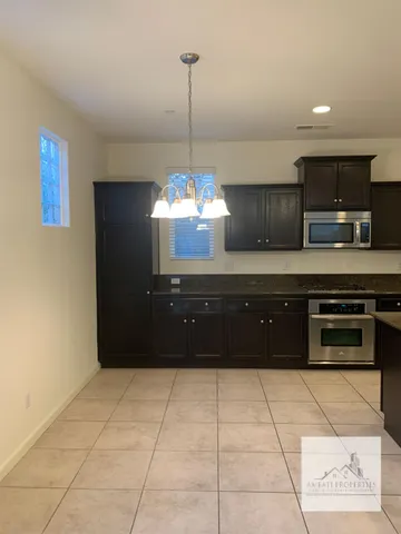 a kitchen with a cabinets and a stove