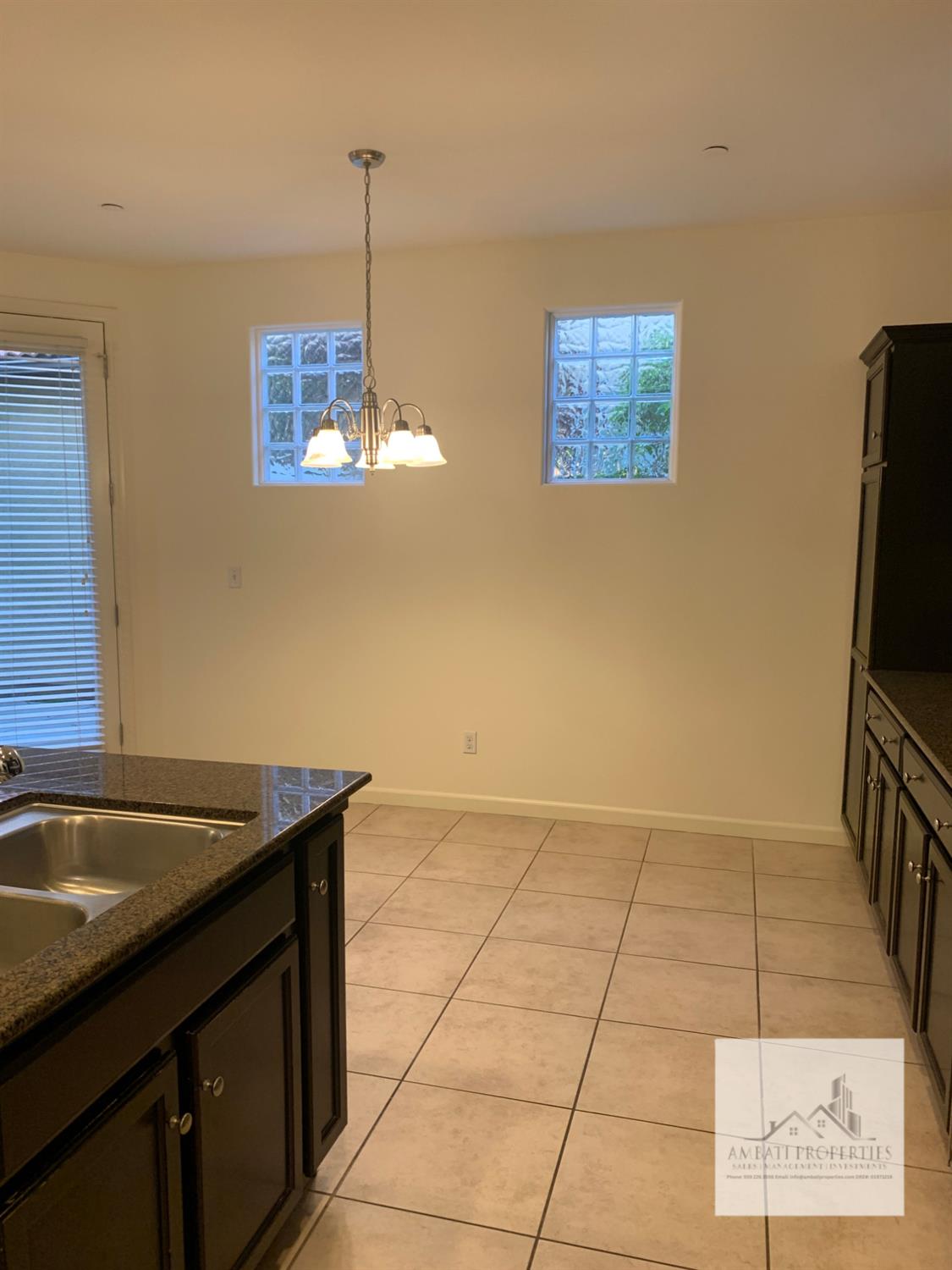 3663 Etchings Way Clovis, CA 93619 - Photo 6 of 26 a kitchen with a sink a counter top space and cabinets