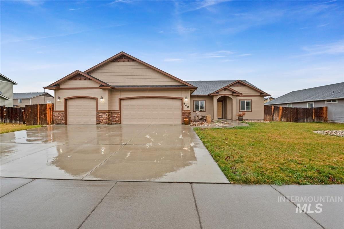 Craftsman-style home with concrete driveway and a garage