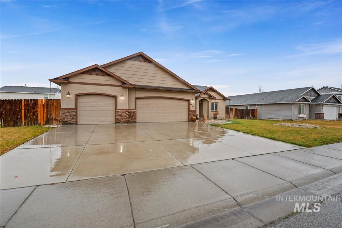 640 Southwest Miner Street Mountain Home, ID 83647 - Photo 2 of 35 View of front facade featuring driveway and a garage