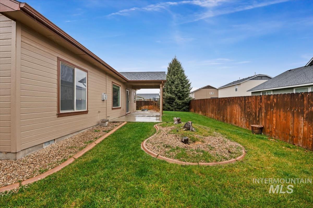 640 Southwest Miner Street Mountain Home, ID 83647 - Photo 35 of 35 Fenced backyard featuring a patio area