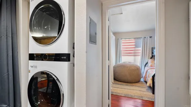 a view of a bedroom with washer and dryer