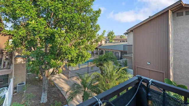 a view of a patio with swimming pool table and chairs