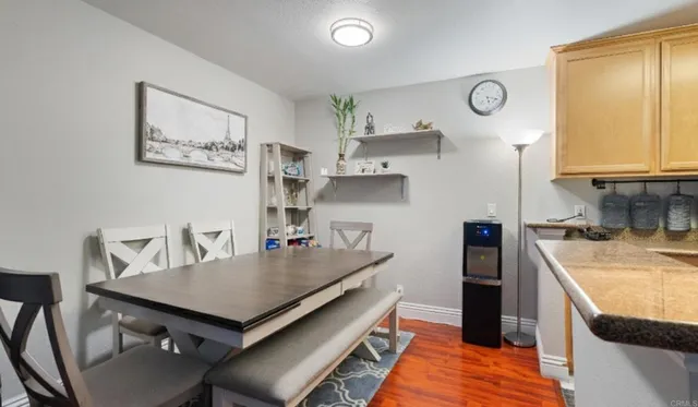 a kitchen with a stove and a refrigerator