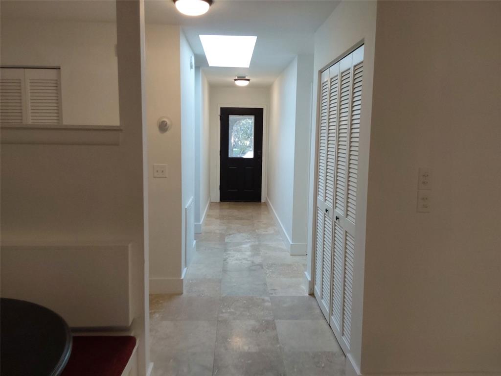 722 Wentworth Street Sebastian, FL 32958 - Photo 7 of 13 a view of a hallway with wooden floor and closet