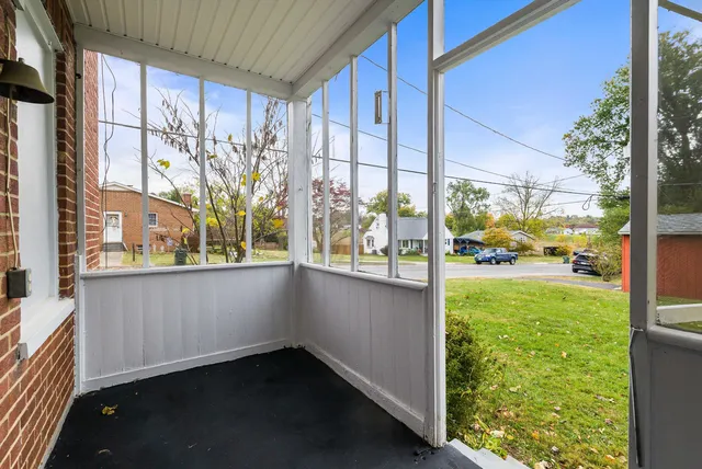 a view of an entryway with a floor to ceiling window